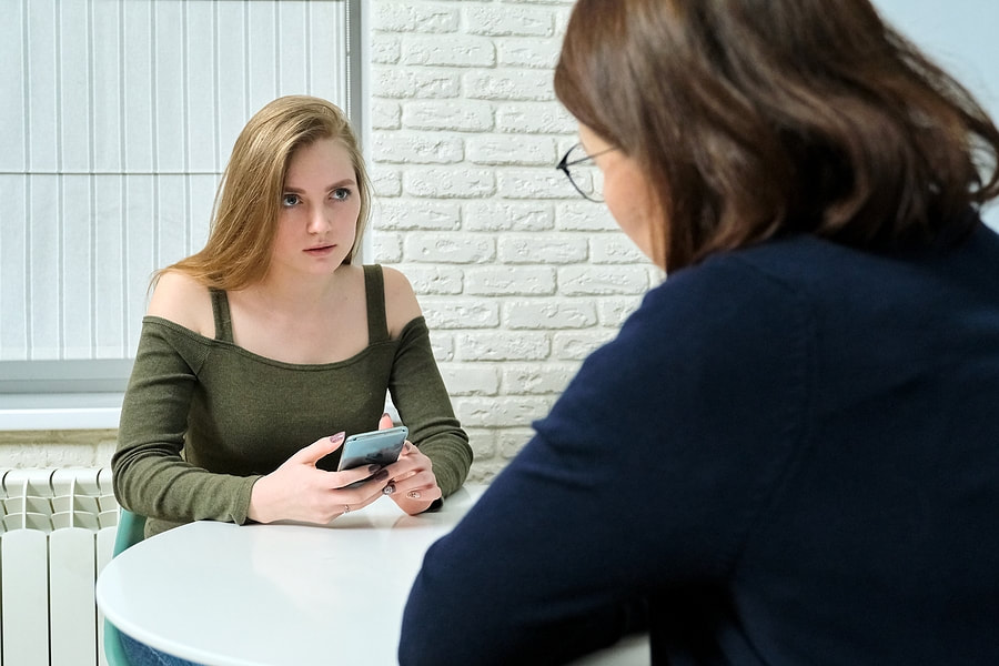 mental health advisor talking to her client